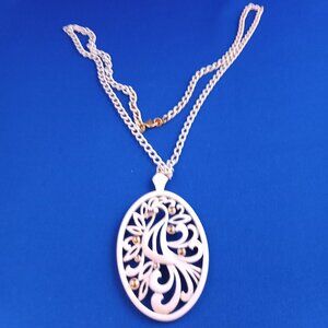 Vintage 1970s Monet white on gold bird of paradise pendant on white chain